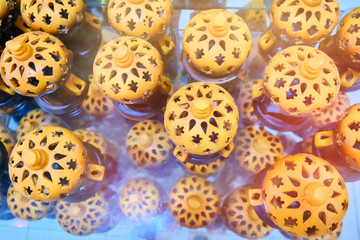 Arabic candle lanterns in the Medina gift shop. Ceramic receptacle for candles.