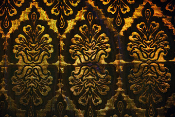 Arabic pattern on the fabric of the sofa, background. Texture of arab ornament