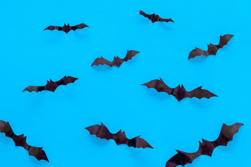 Halloween background with bats on blue table top view