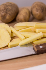 peeled potatoes cut with knife