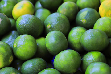 Green limes close up on the market