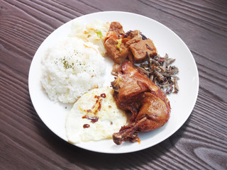 Rice with deep fried chicken leg on white plate, Traditional taiwanese food