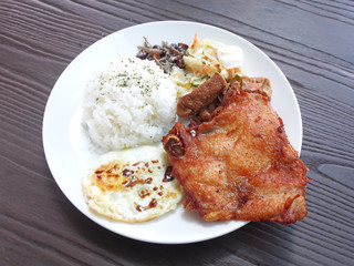 Rice with deep fried spare ribs on white plate, Traditional taiwanese food