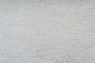 building background: rough wall of lime plaster