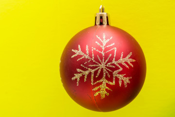 Vintage Ornament Christmas Decoration on bright yellow background. Winter Holidays concept.