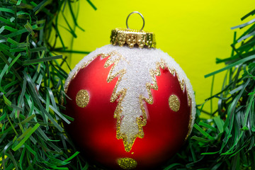 Vintage Ornament Christmas Decoration on bright yellow background. Winter Holidays concept.