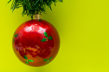 Vintage Ornament Christmas Decoration on bright yellow background. Winter Holidays concept.