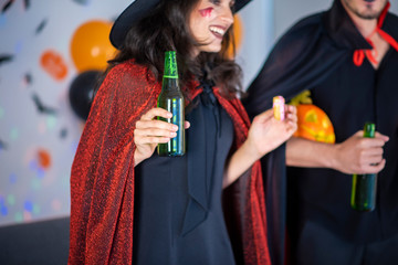 happy couple of love  in costumes and makeup on a celebration of Halloween