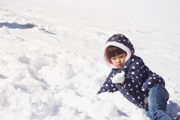 Fototapeta na wymiar Portrait of a little girl in winter outfit in Wyoming, USA
