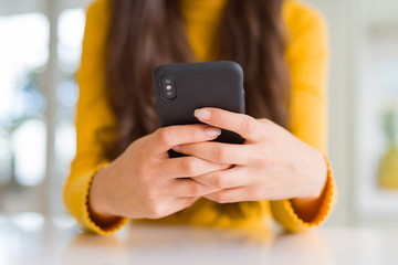 Close up of woman hands using smartphone