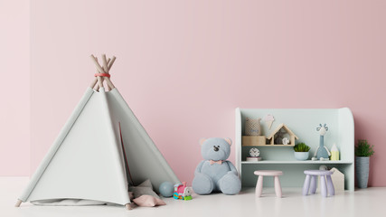 Mock up in children's playroom with tent and table sitting doll on empty pink wall background.