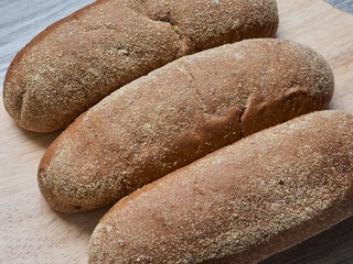 Brown whole wheat bread background, closeup