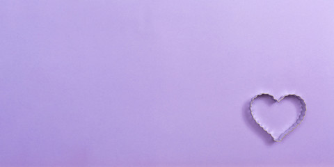 Valentine's day heart ornaments on a purple background