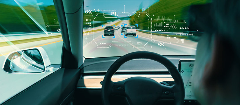 Person in a self driving autonomous car with autopilot