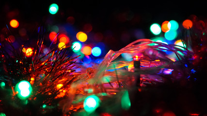 Christmas colorful New Year's Bokeh neon lights. Abstract Blurred photo background with blinking...
