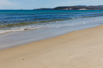 sunny pristine and deserted beach overlooking the South Pacific Ocean
