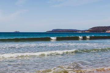 sunny pristine and deserted beach overlooking the South Pacific Ocean