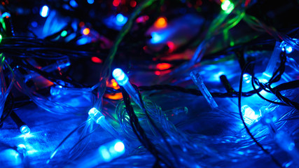 Christmas colorful New Year's Bokeh neon lights. Abstract Blurred photo background with blinking...