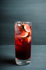 Cocktail with figs on the rustic background. Selective focus. Shallow depth of field.