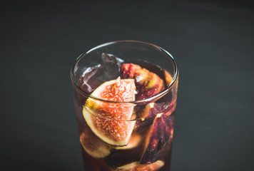 Cocktail with figs on the rustic background. Selective focus. Shallow depth of field.