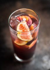 Cocktail with figs on the rustic background. Selective focus. Shallow depth of field.