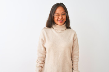 Young chinese woman wearing turtleneck sweater and glasses over isolated white background winking...