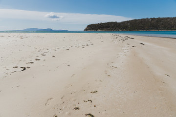 sunny pristine and deserted beach overlooking the South Pacific Ocean
