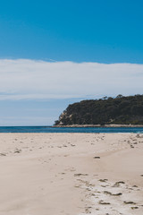 sunny pristine and deserted beach overlooking the South Pacific Ocean