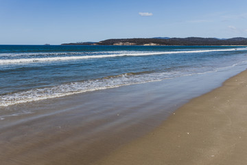 sunny pristine and deserted beach overlooking the South Pacific Ocean