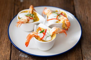 Steamed Seafood Curry Cakes with coconut cream and Prawn.