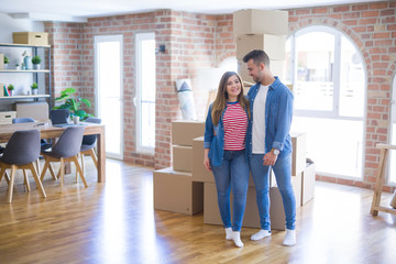 Young beautiful couple in love moving to new home, very happy and cheerful for new apartment