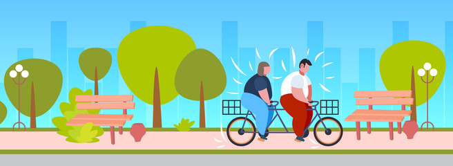 fat obese couple riding tandem bicycle overweight man woman cycling twin bike weight loss concept summer park landscape background flat full length horizontal