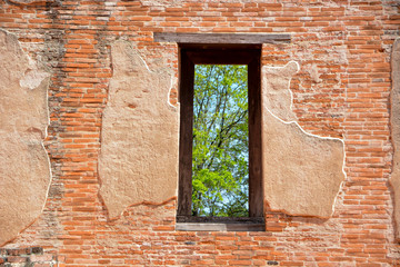 Window on the ancient brick wall
