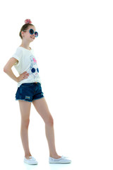 Little girl in sunglasses.The concept of youth fashion and style