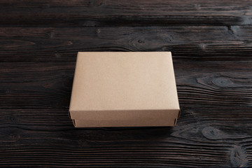 Cardboard box on a wooden background