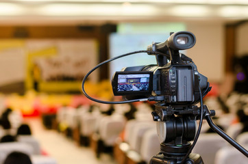 Video Camera recording seminar or learning in Conference room with blurred background, copy space