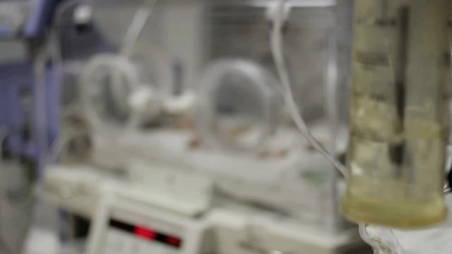 Beloretsk, Bashkortostan, Russia - August 25, 2019. Premature baby lies in an incubator_1