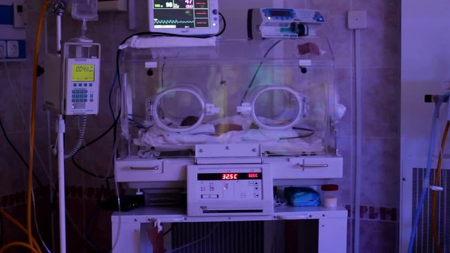 Beloretsk, Bashkortostan, Russia - August 25, 2019. Premature baby lies in an incubator_3