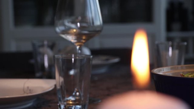 Candle on dinner table, Scandinavia.