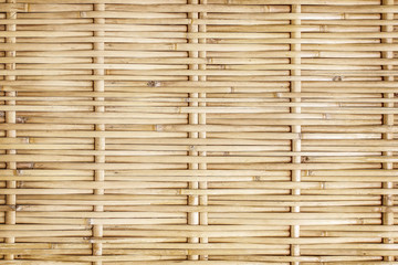 old grungy thai handcraft of bamboo weave pattern fence.