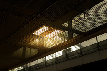 orange rectangular ceiling lamp in the dark black industrial loft interior architecture background