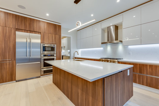 Interior design of a modern kitchen in the newly built house  with stainless steel appliances.