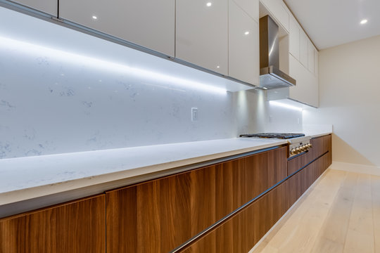 Interior design of a modern kitchen in the newly built house  with stainless steel appliances.