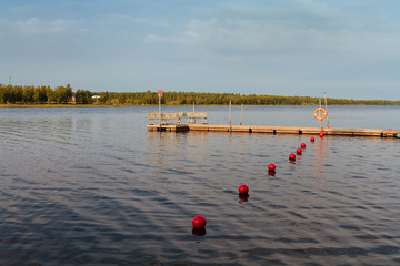 Pier And Buoys On The Lake