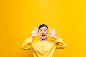 Woman feel scared standing isolated over yellow background