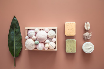 Spa composition with body care items on a colored background.