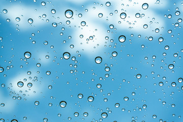 Rain on the window, natural skin of the rain The natural form of rainwater on a sky background.