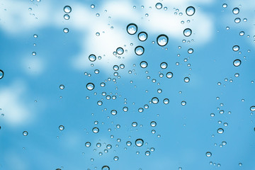 Rain on the window, natural skin of the rain The natural form of rainwater on a sky background.