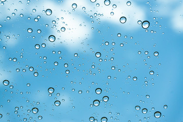 Rain on the window, natural skin of the rain The natural form of rainwater on a sky background.