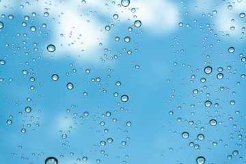 Rain on the window, natural skin of the rain The natural form of rainwater on a sky background.